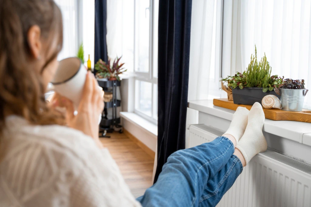 close-up-woman-sitting-near-heater.jpg close-up-woman-sitting-near-heater.jpg